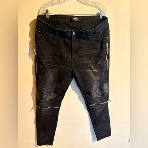 AMIRI MX2 distressed black denim jeans, ribbed leather panels and zipper details